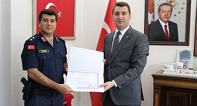 İhsaniye'den tayini çıkan jandarma personele başarı belgesi